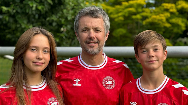 King Frederik with Princess Josephine and Prince Vincent in red Danish football tops