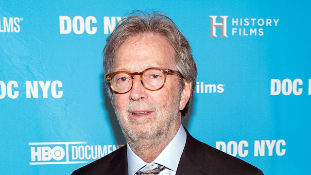 eric clapton in dark suit