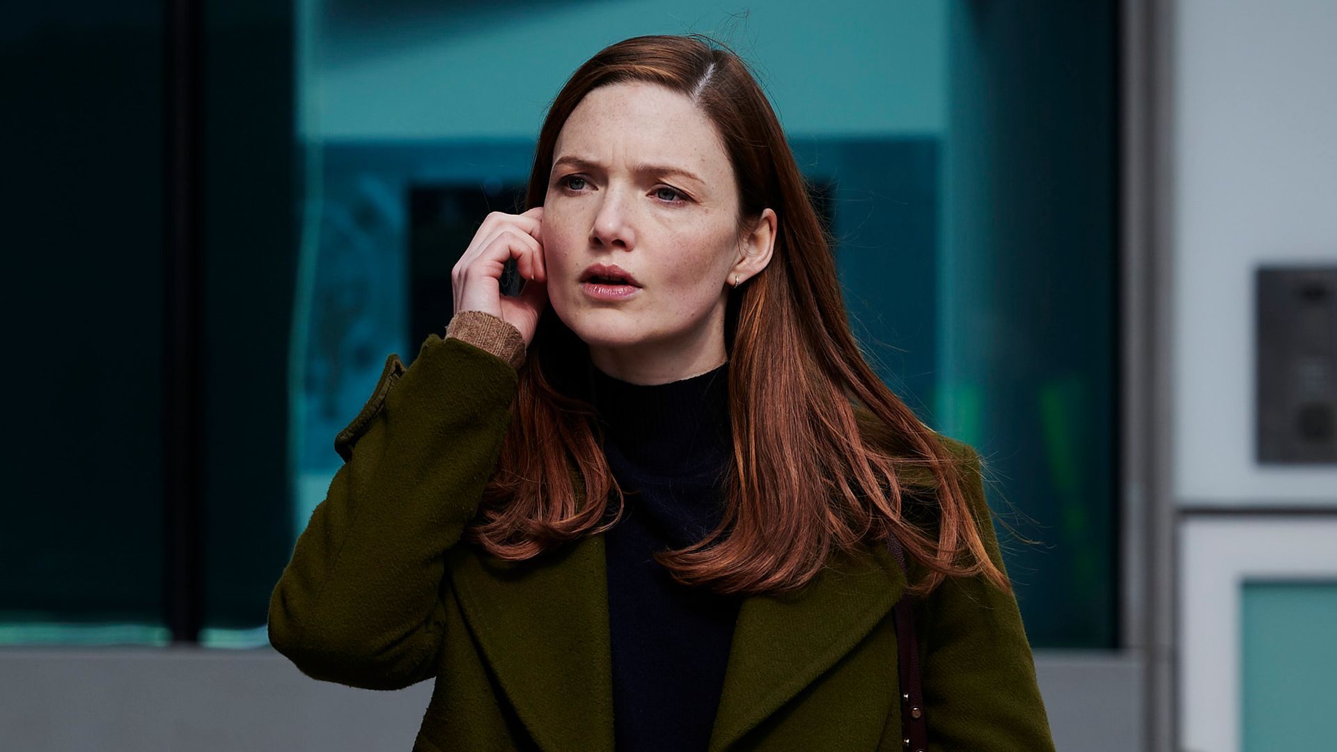 Woman walking in street on phone