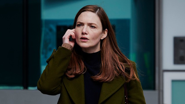 Woman walking in street on phone