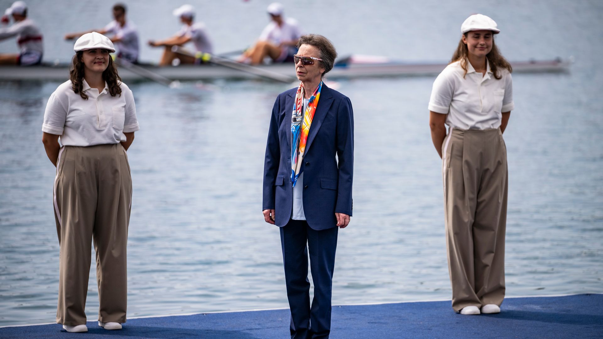 Princess Anne standing with rowers