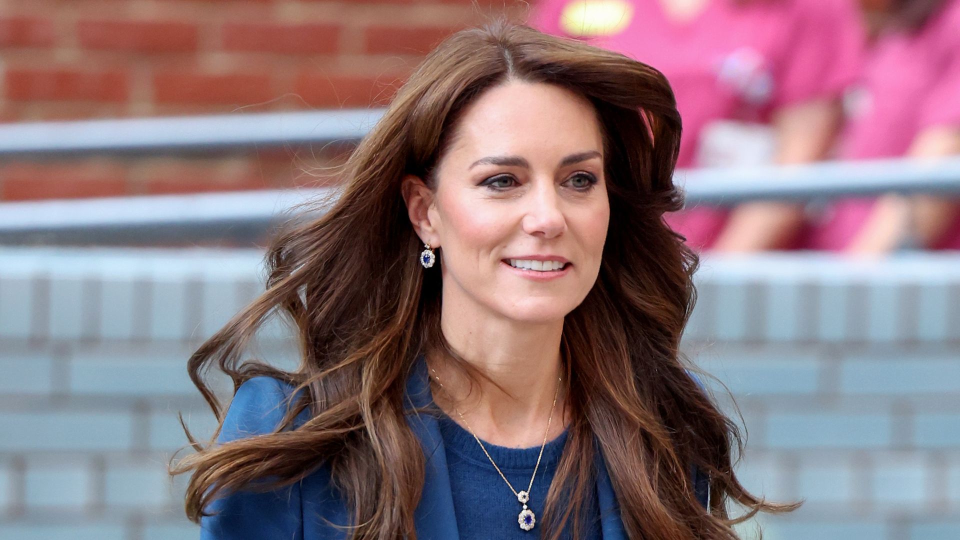Kate Middleton wearing blue suit at Evelina London