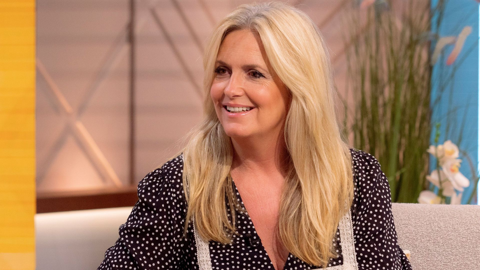 Penny Lancaster smiling in a polka dot top at the Menopause Mandate
