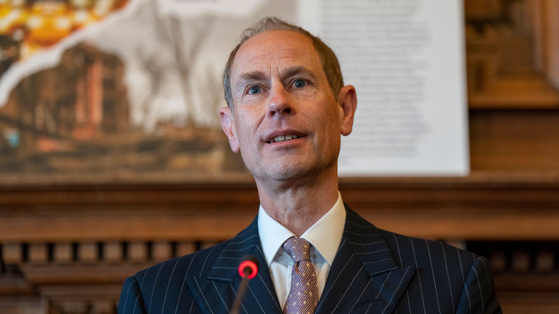 Prince Edward in a suit giving a speech