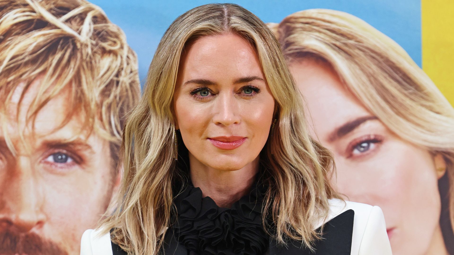 Emily Blunt's sheer shirt and white power suit is 2024's chicest red carpet look