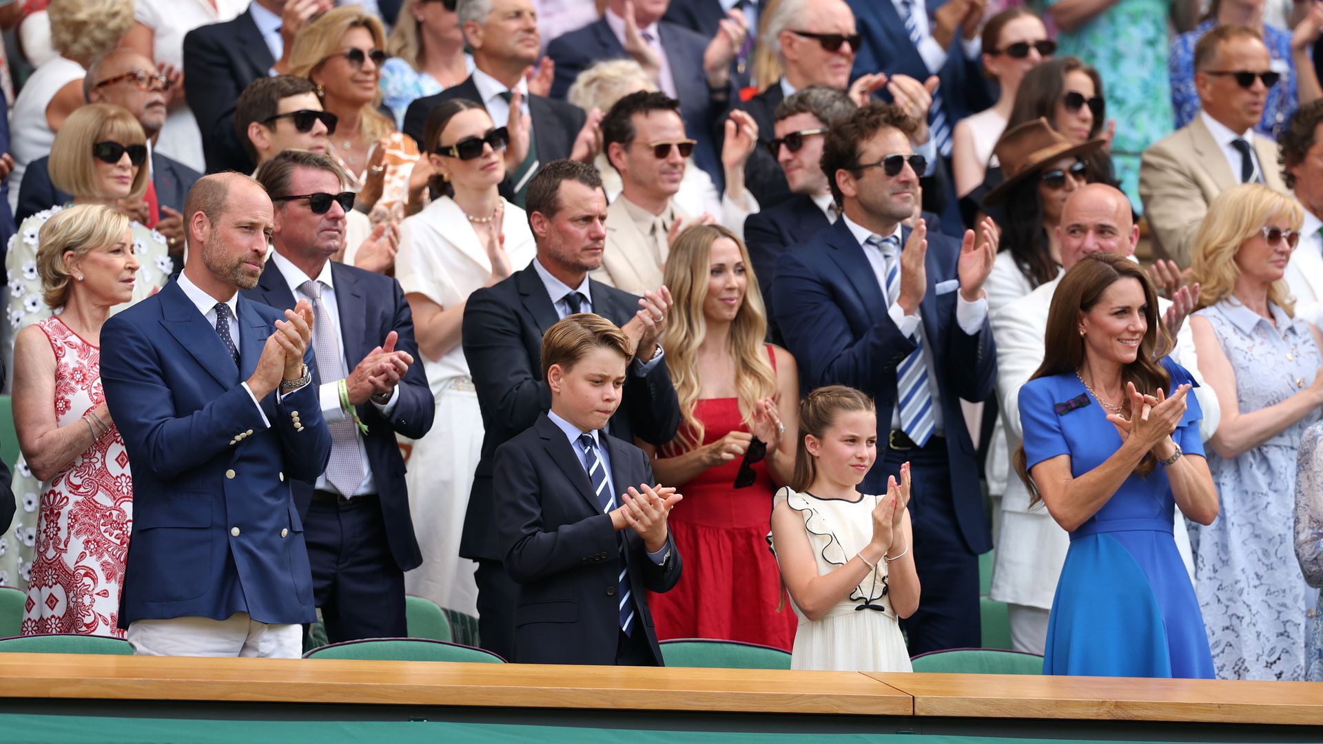 Prince William, Prince of Wales, Prince George of Wales, Princess Charlotte of Wales and Catherine, Princess of Wales applaud from the Royal Box 