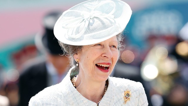 Princess Anne in white suit smiling