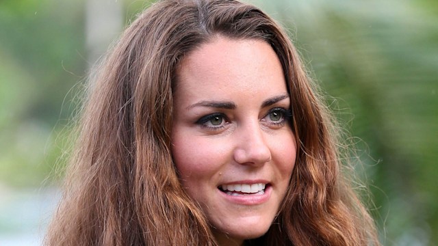 Kate Middleton with curly hair on the Tuvanipupu Island on their Diamond Jubilee tour of the Far East on September 17, 2012