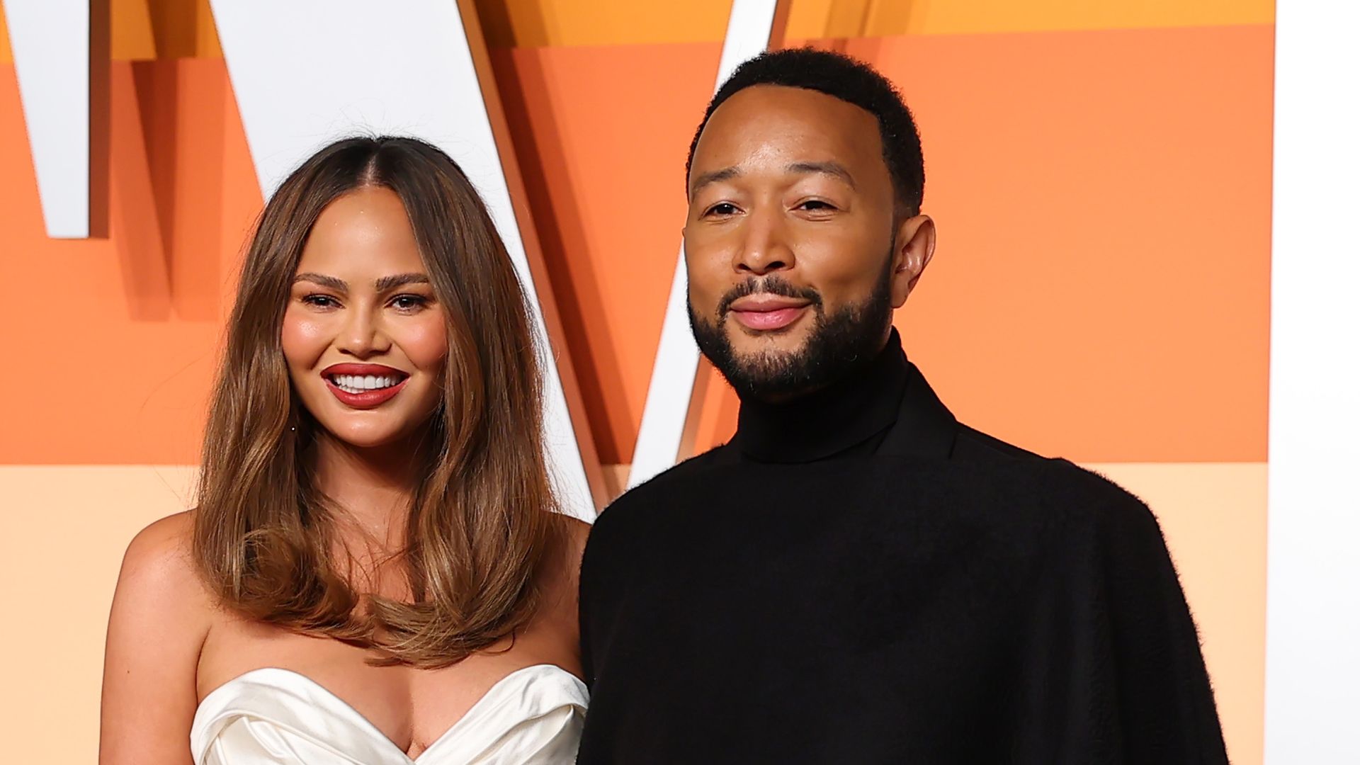 Chrissy Tiegan and John Legend posing together