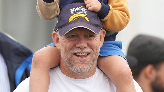 Mike Tindall with Lucas Tindall on his shoulders