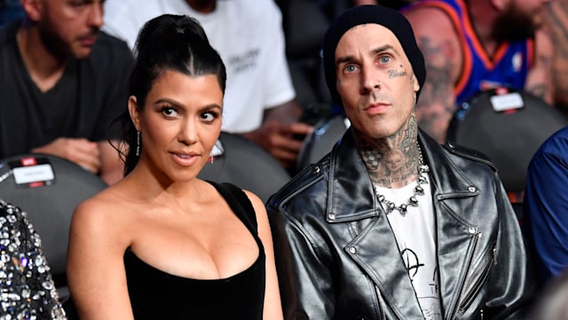 Kourtney Kardashian and Travis Barker are seen in attendance during the UFC 264 event at T-Mobile Arena on July 10, 2021 in Las Vegas, Nevada