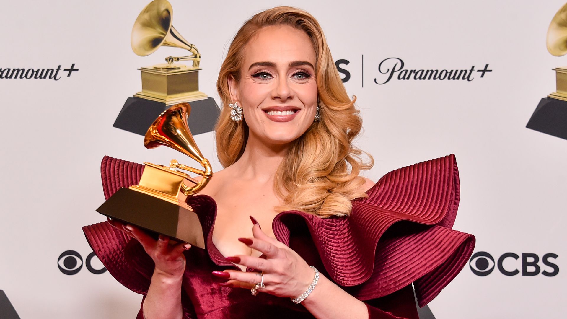 Adele smiling with her Grammy