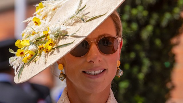 Zara Tindall arrives at Royal Ascot wearing a cream lace dress and floral hat on Gold Cup Day on 22 June 2023 in Ascot, United Kingdom.