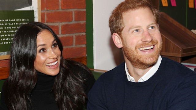 Harry and Meghan smiling in Edinburgh