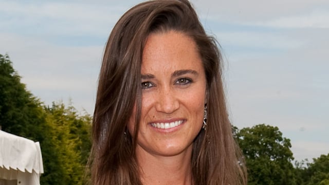 Pippa Middleton poses in field in white dress