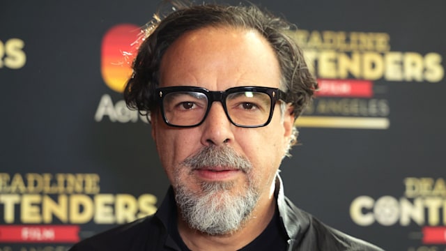 Alejandro Gonzalez Inarritu in black jacket and glasses 