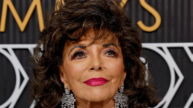 Joan Collins in a silver dress and earrings
