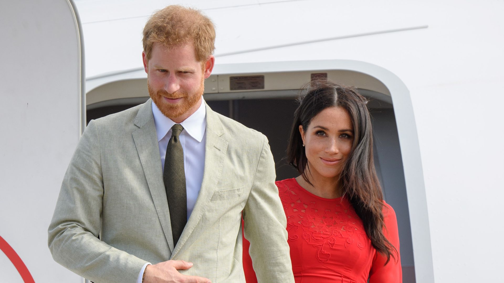 Harry and Meghan at airport in Tonga, 2018