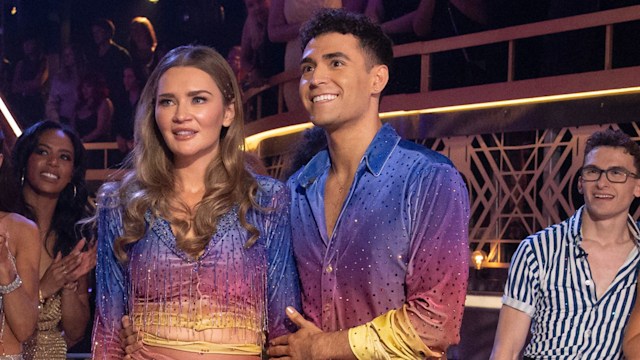 Anna Delvey (second right) with Ezra Sosa (right) stand in front of other hopefuls on Dancing with the Stars