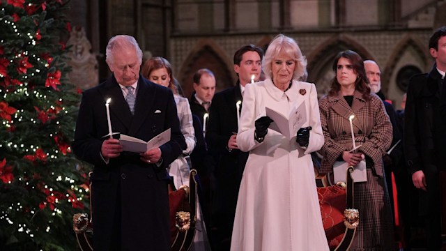 King Charles and Queen Camilla singing carols at christmas