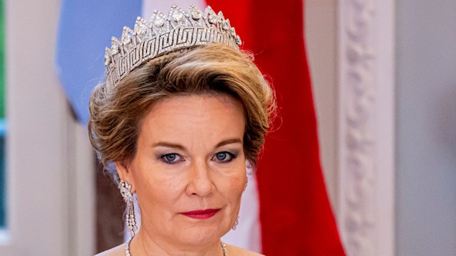 Queen Mathilde in silver dress and crown