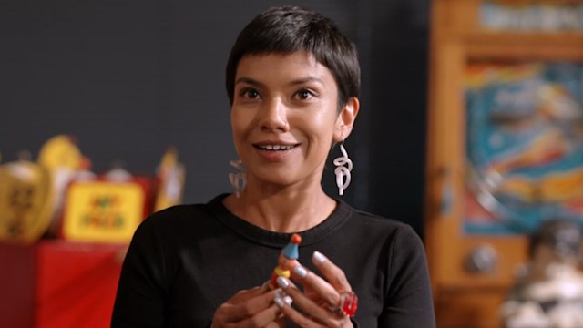 Woman holding antique toy
