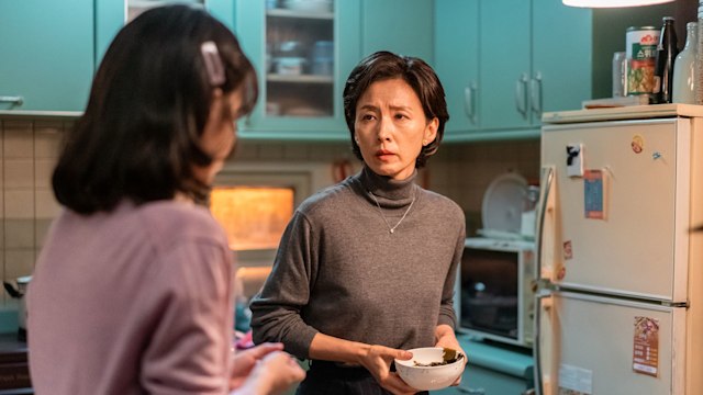 mother in kitchen looking at daughter