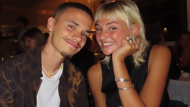 romeo beckham smiling with his girlfriend at dinner