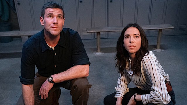 man and woman crouching in locker room