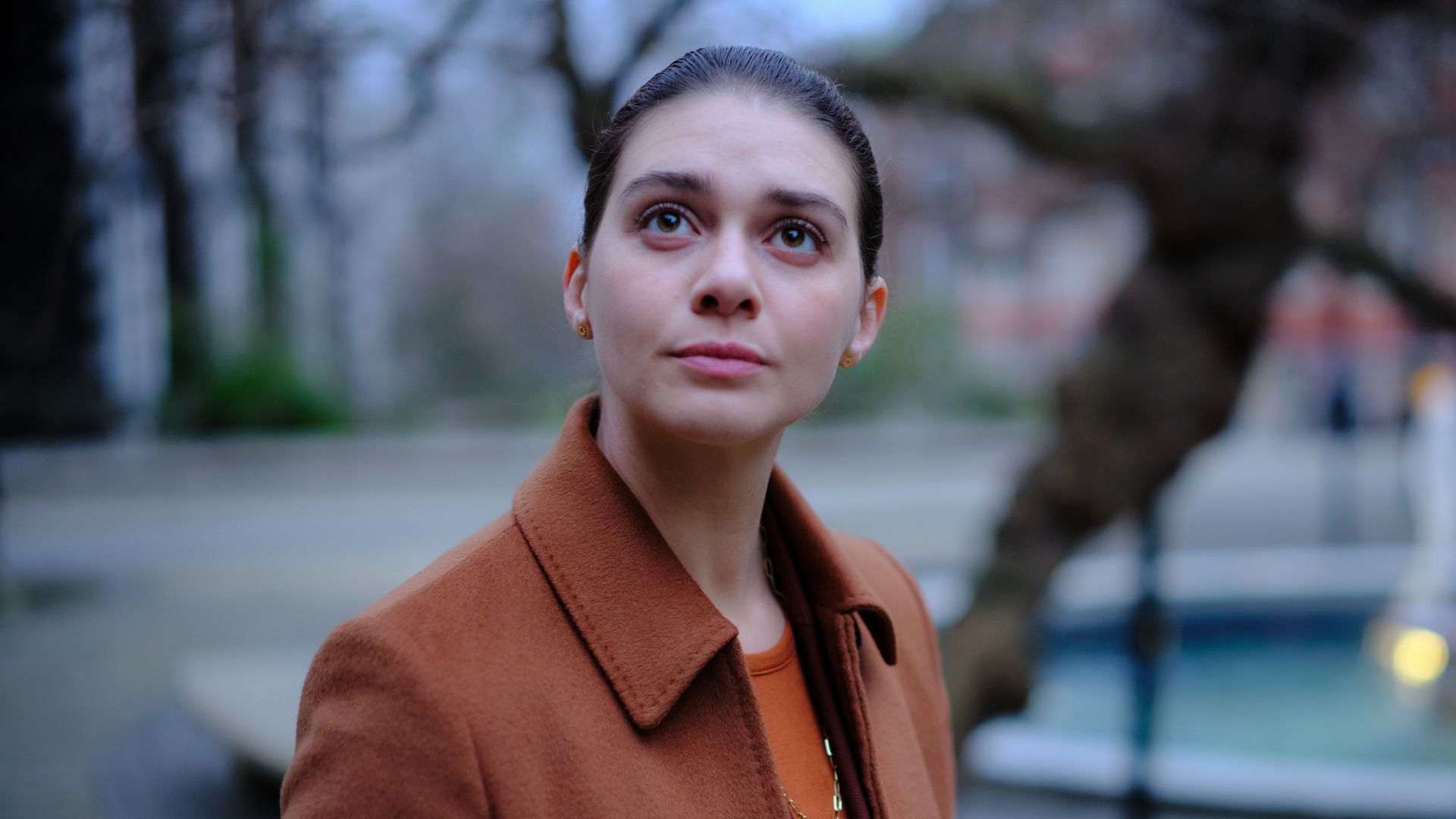 woman standing outdoors by fountain