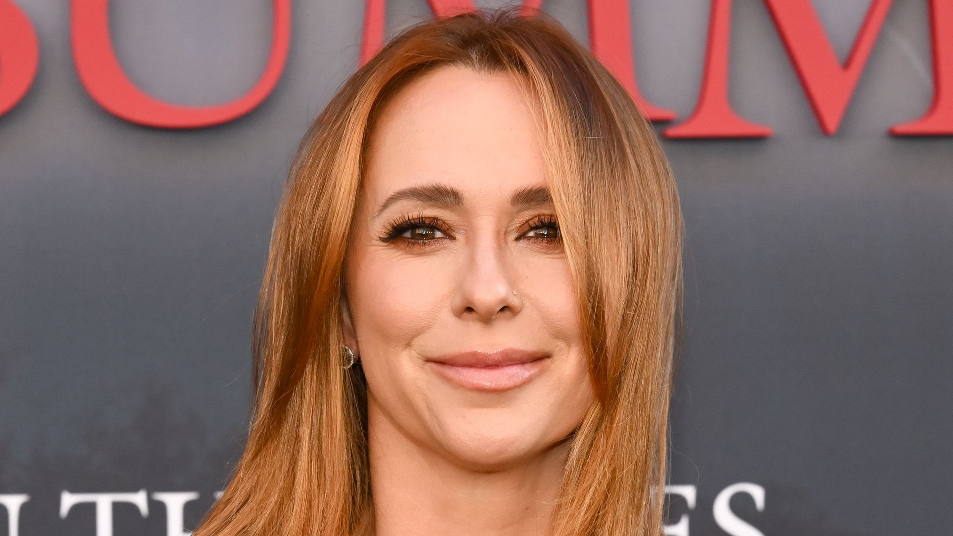 jennifer love hewitt in black dress with red hair