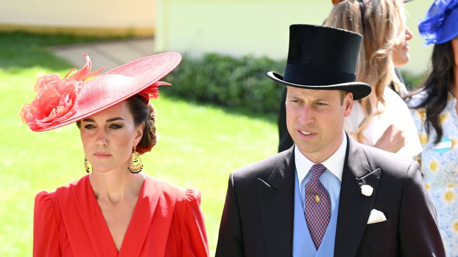 Princess Kate in red dress and Prince William in suit and top hat