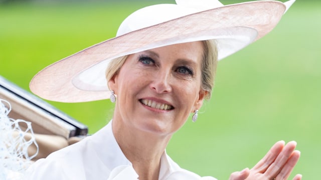 Sophie, Duchess of Edinburgh waving in white dress and hat