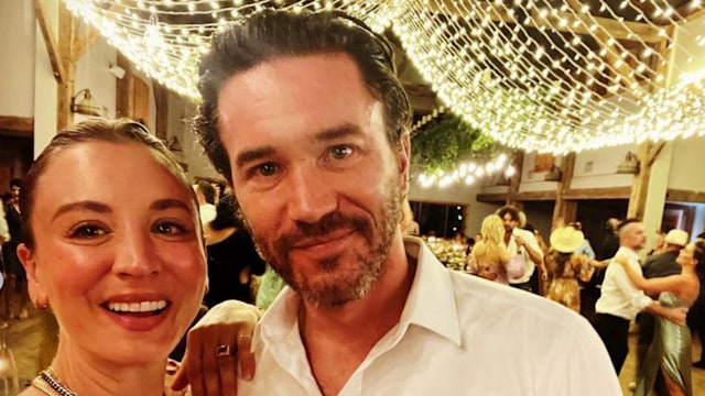 Photo shared by Tom Pelphrey on Instagram September 27 2023 where ehe and Kaley Cuoco are smiling for a selfie while attending a wedding.