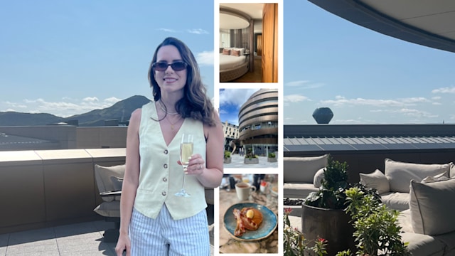 woman with champagne on hotel balcony