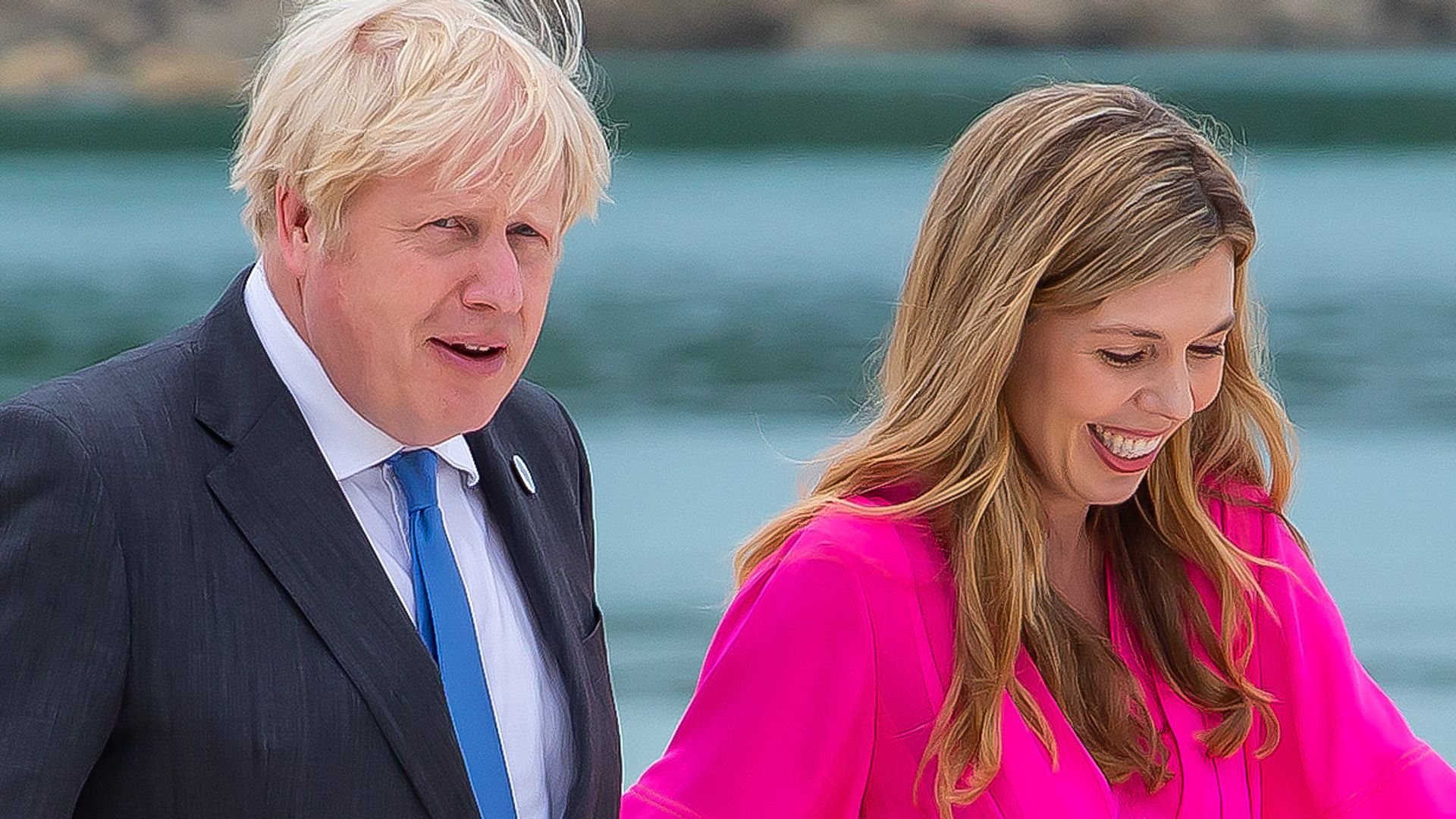 Boris Johnson and wife Carrie Johnson walking along the beach