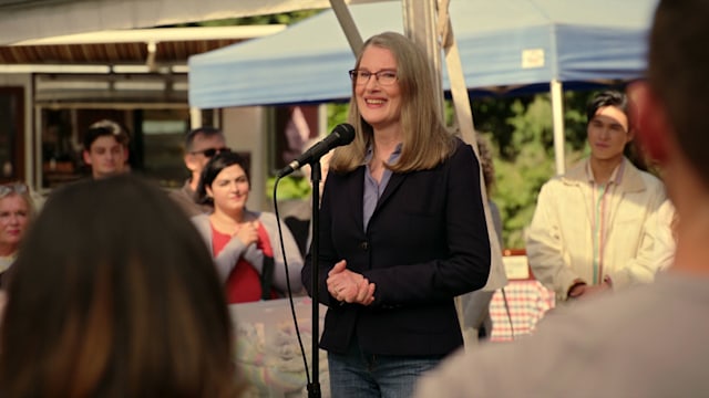 Hope McCrea speaks into microphone in Virgin River