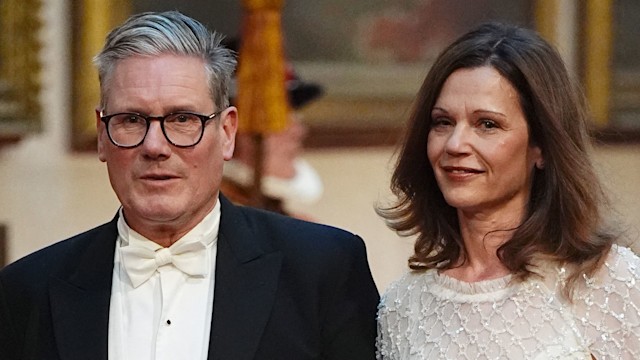 Keir Starmer with his wife Victoria make their way along the East Gallery to attend a State Banquet at Buckingham Palace in London on June 25, 2024