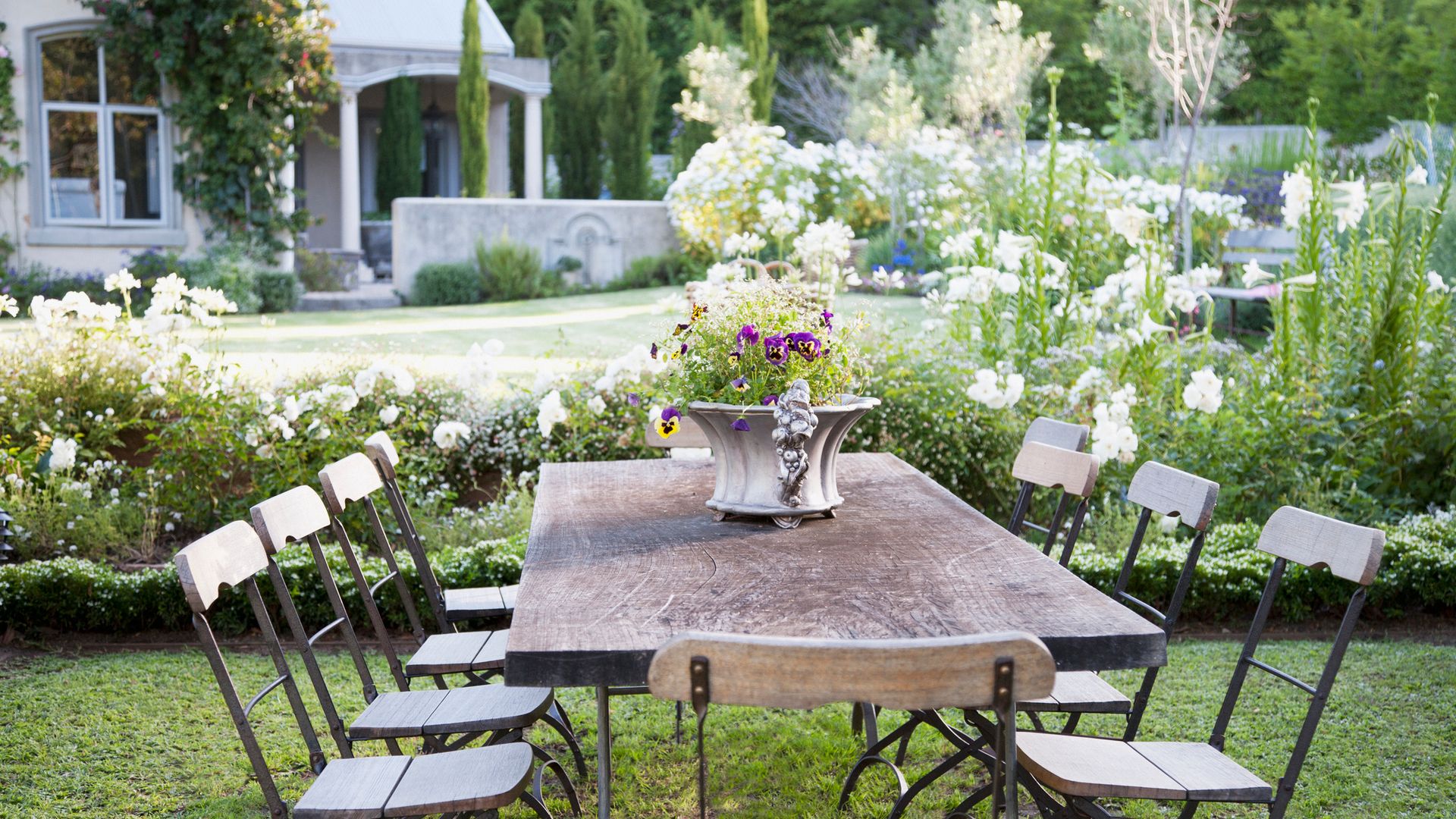 Flowerpot on table in garden
