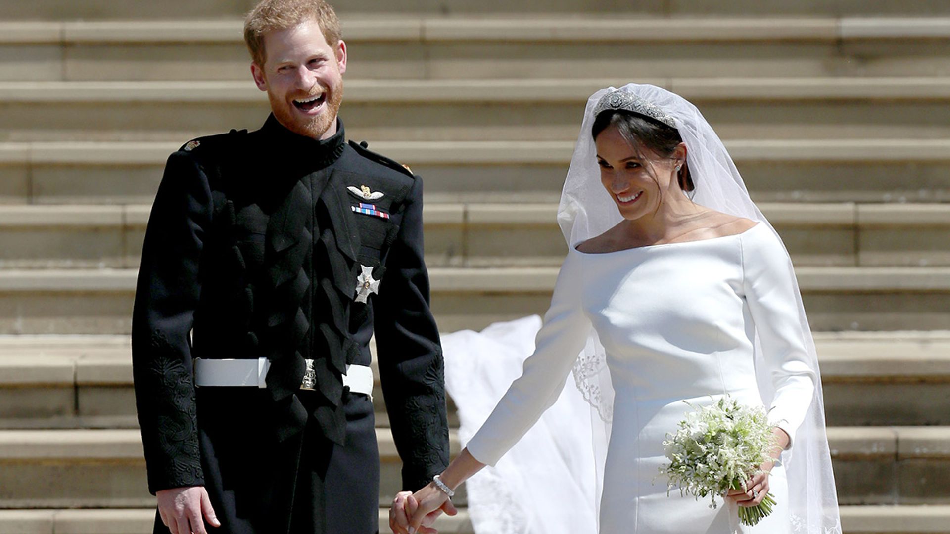 prince harry and meghan holding hands wedding
