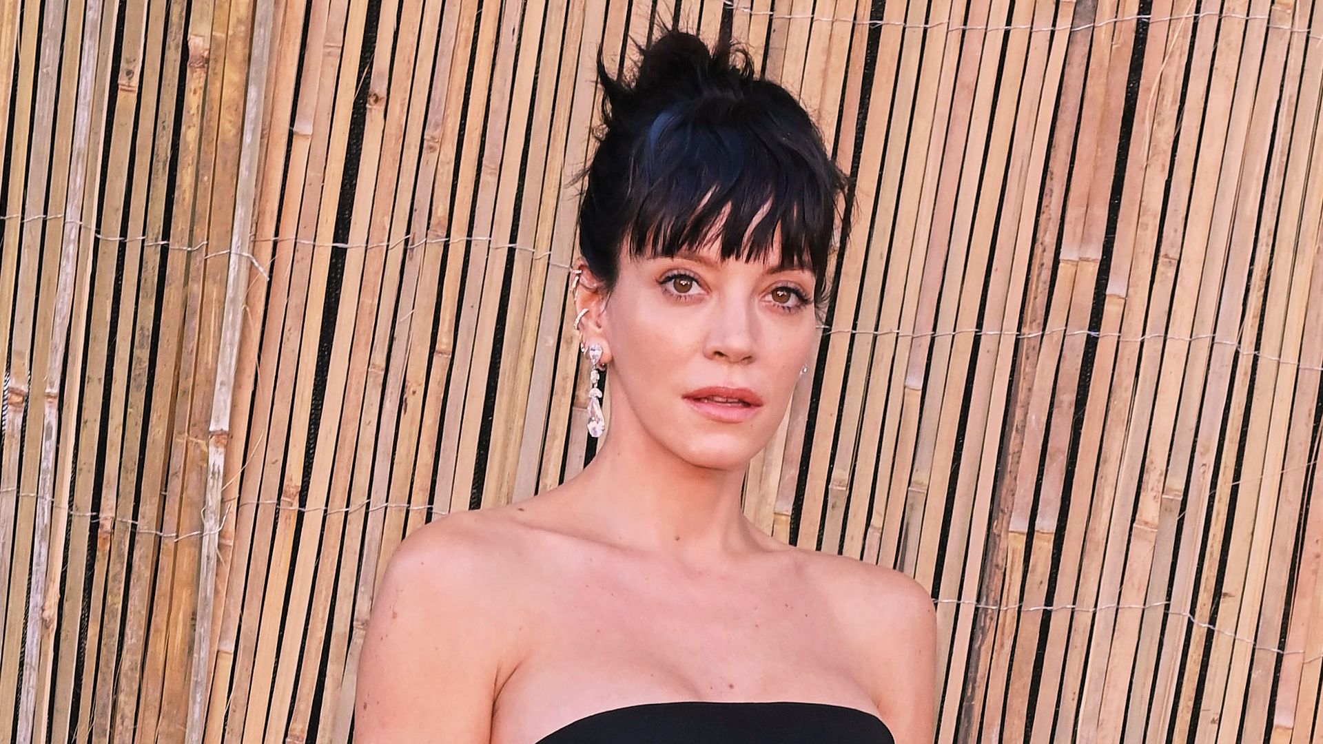 Lily Allen wearing a black dress