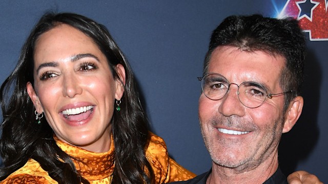 Simon Cowell and Lauren Silverman posing for a photo