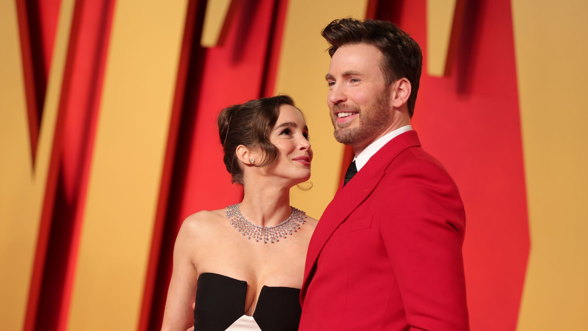 Alba Baptista and Chris Evans at the 2024 Vanity Fair Oscar Party held at the Wallis Annenberg Center for the Performing Arts on March 10, 2024 in Beverly Hills, California