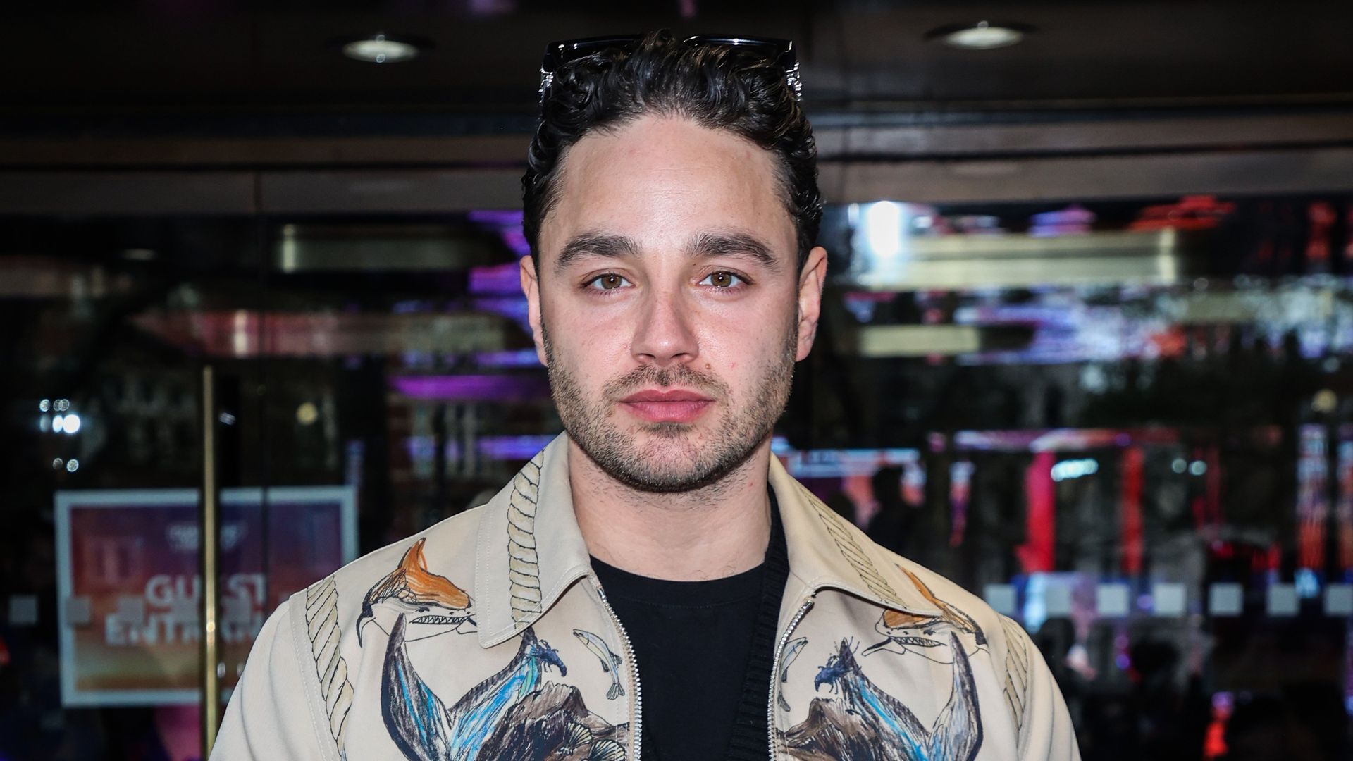 Adam Thomas looking serious at an event