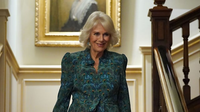 Queen Camilla wears a stunning green dress