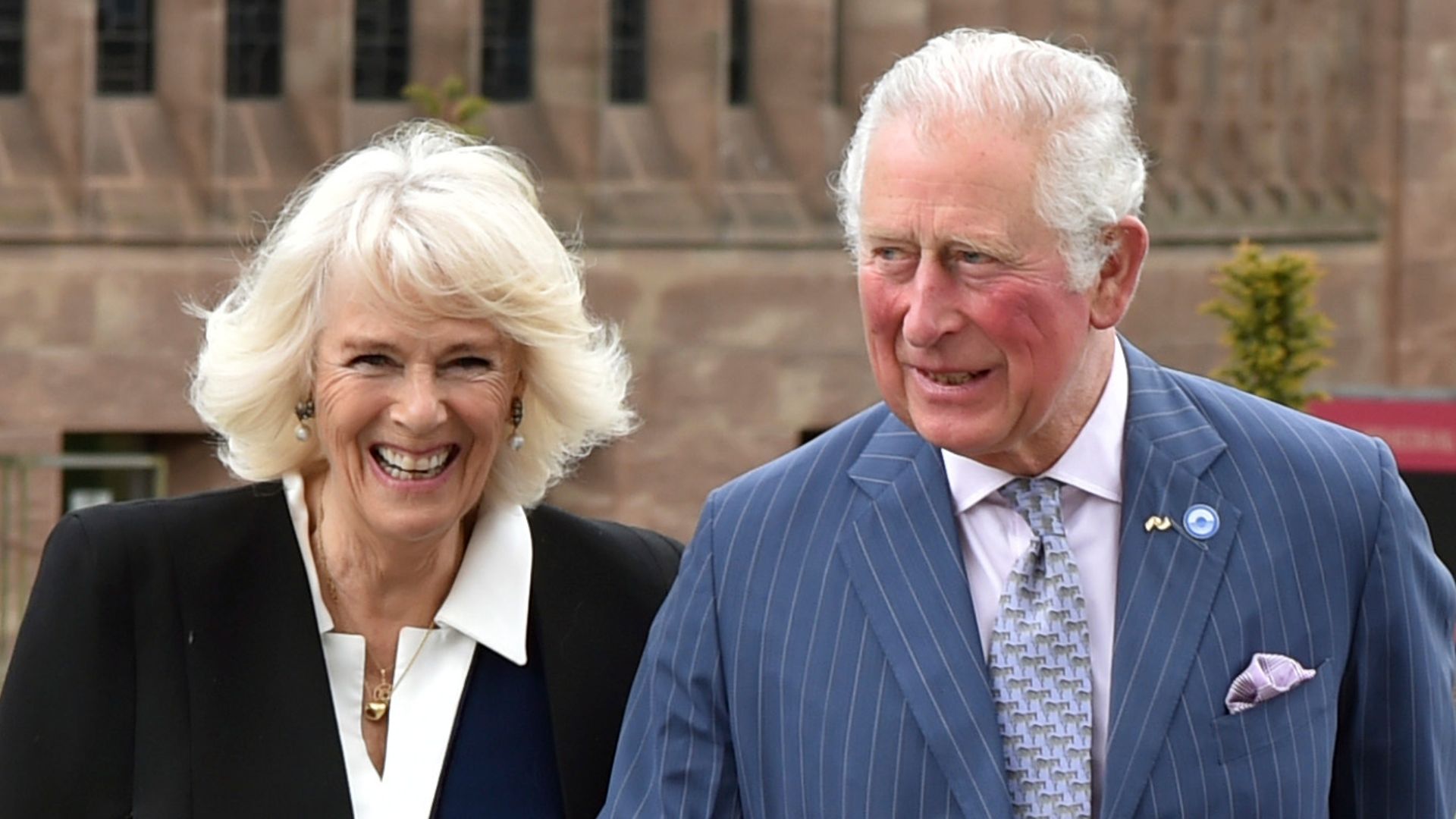 King Charles and Queen Camilla walking