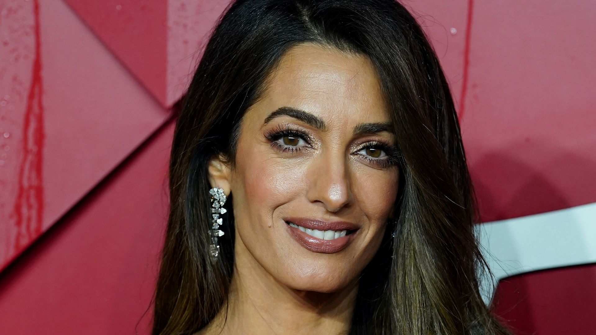 Amal Clooney, 45, steals the show in dazzling gold gown as she dominates the red carpet