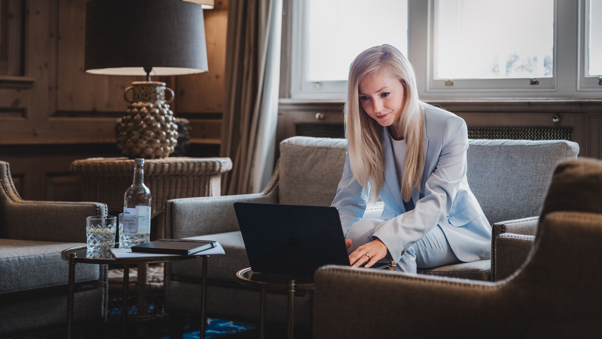 young blonde woman on her laptop