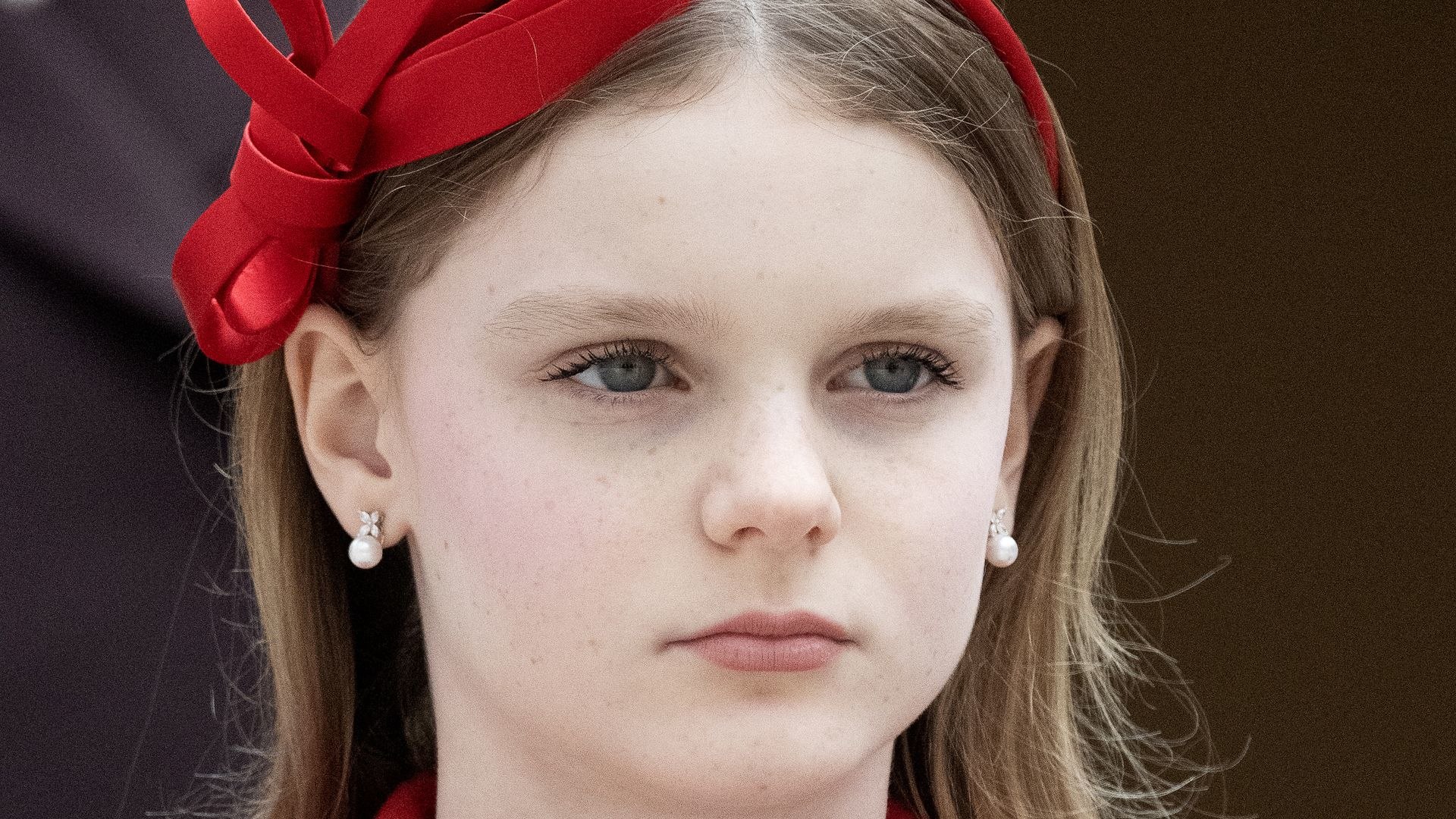 Princess Gabriella in red coat and headband