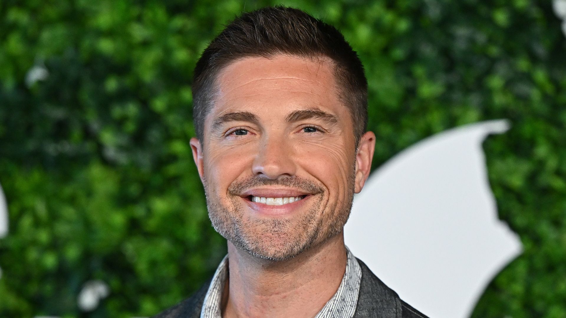Close up of Eric Winter smiling at the Monte Carlo TV Festival in 2023